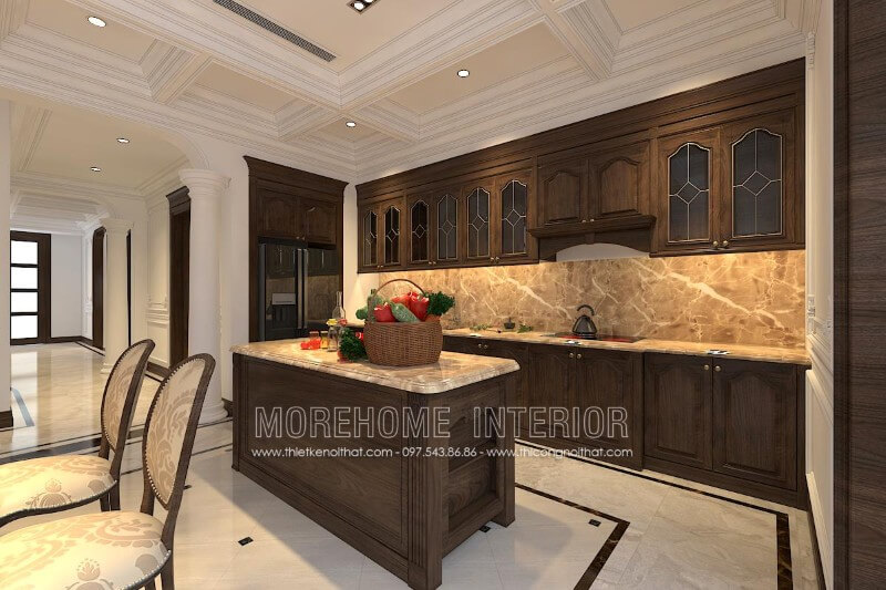 Thiết kế tủ bếp gỗ óc chó tân cổ điển kết hợp bàn đảo cùng chất liệu được đặt chính giữa tạo sự cân bằng cho không gian cũng như tiện nghi hơn cho người nội trợ Thiết kế tủ bếp đẹp